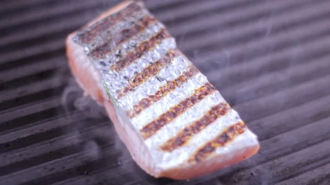 Cook prepares salmon on the grill Stock Footage 109471382