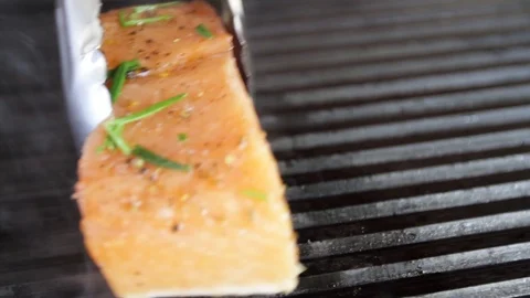 Cook prepares salmon on the grill Stock Footage 109471423