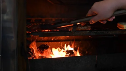 The cook prepares steaks on the grill Stock Footage 125889851