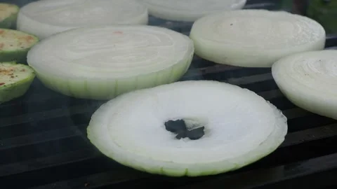 The cook prepares vegetables with meat on the grill.roasting on the fire. 4K Stock Footage 134901896