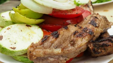 The cook prepares vegetables with meat on the grill.roasting on the fire. 4K Stock Footage 134901955