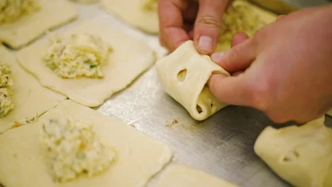 Cook preparing buns with cheese Stock Footage 69778276