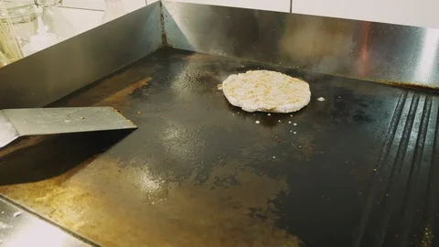 Cook preparing burger . The process of cooking a burger. Stock Footage 96043337