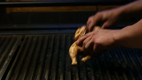 The cook preparing chicken on the griddle Stock Footage 132530678