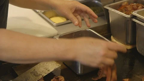Cook preparing containers for breakfast diner Stock Footage 104873107