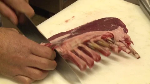Cook preparing goat ribs Stock Footage 70566387