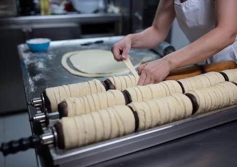 The cook is preparing Hungarian rolls. Stock Photos