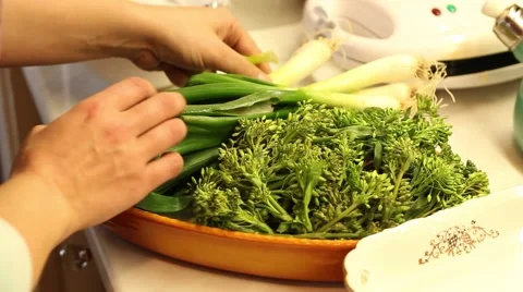 Cook preparing kale buds and leek in the kitchen Video stock 47210618