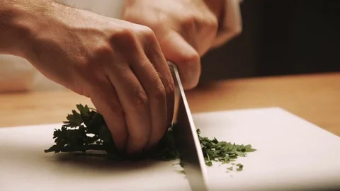 Cook preparing meal at the kitchen table. Close up Stock Footage 73274786