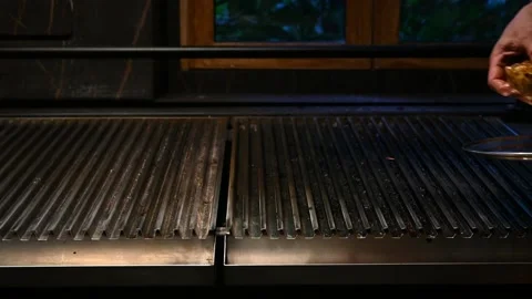 The cook preparing meat on the griddle 스톡 동영상 132530658