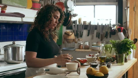 Cook preparing papaya on a cutting board for an octopus carpaccio dish in a larg Stock Footage 199456145