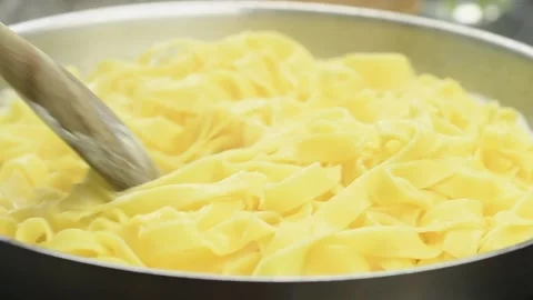 The cook preparing pasta in a pan. Stock Footage 165615597