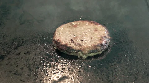 Cook preparing pieces of roasted burger cutlet beef meat on grill. Street food. Stock Footage 51173807
