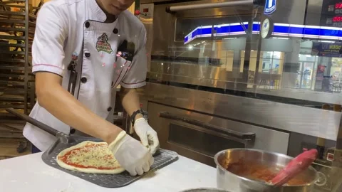 A cook is preparing the pizza dough Stock Footage 347544224
