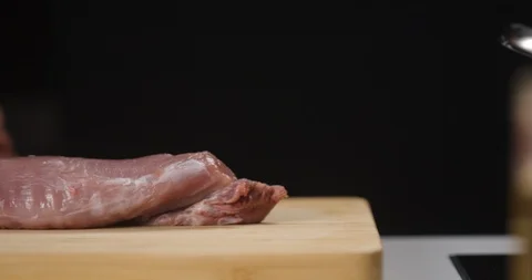 Cook preparing pork meat on cutting board Stock Footage 126679284