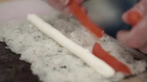 Cook preparing rolls. Cook adds tomatoes and meet in rolls Stock Footage 106670140