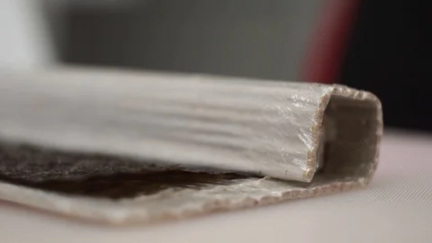 Cook preparing rolls. Using the mat twists the workpiece. Stock Footage 106670451