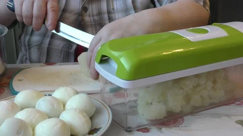 The cook is preparing a salad using a food processor. healthy food concept Stock Footage 197049404