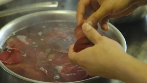 Cook Preparing Sausages in Kitchen Stock Footage 127036478