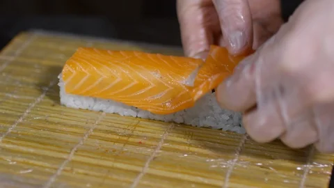 Cook Preparing Sushi with Salmon Stock Footage 88040454