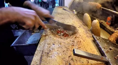 Cook preparing Turkish Kokorec lamb intestine food sandwich. Stock Footage 58167181