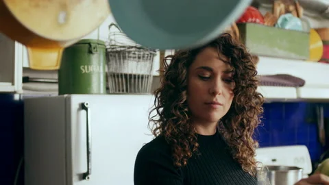 Cook prepping celery in a large kitchen with an array of a equipment and applian Stock Footage 199457678