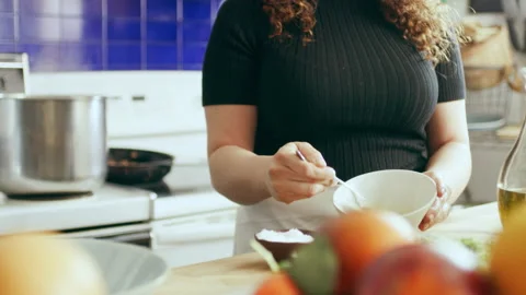 Cook prepping ingredients in a large kitchen with an array of a equipment and ap Stock Footage 199458515
