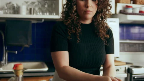Cook prepping vegetables in a large kitchen with an array of a equipment and app Stock Footage 199460319