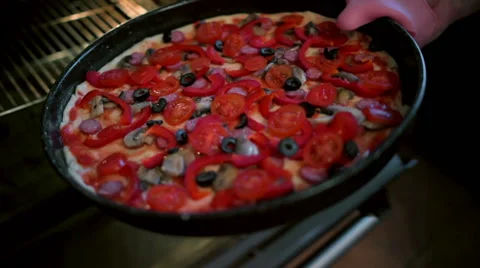 Cook Pulls A Pizza Out Of The Oven. Stock Footage 61907557