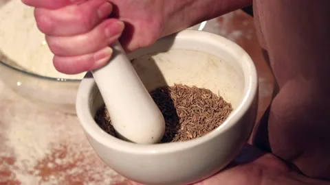 The cook pushes the grain in the pusher Stock-Footage 128645169