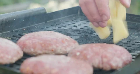 Cook put Potatoes on Grill, Chef Cooks Lunch, Man Fries Pork Cutlets On Grill Stock Footage 131776203