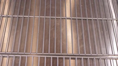 Cook puts baked pizza on grid for serving customer order Stock-Footage 132474002