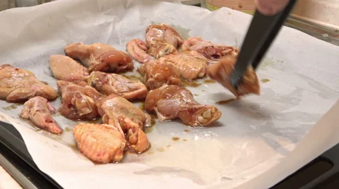 Cook puts on a baking chicken for roasting Stock Footage 47326555