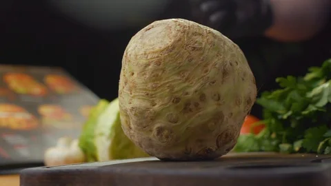 The cook puts the celery root on the table Stock Footage 121701851