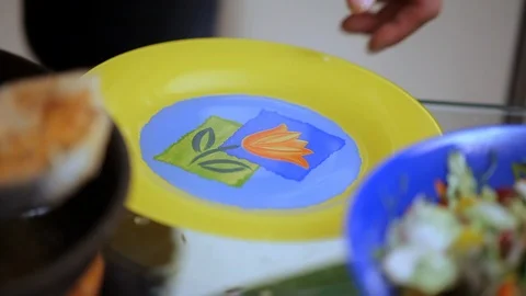 Cook puts grilled fish Stock Footage 99791595