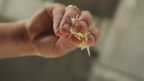 Cook puts his hands on the cheese on the pizza Stock Footage 130557754