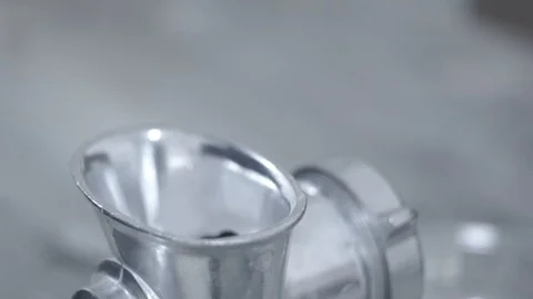 The cook puts the meat in a meat grinder. Close-up Stock Footage 106631164