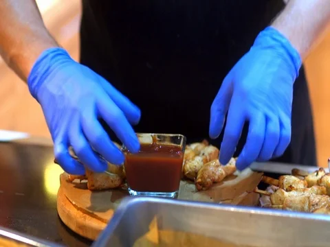 The cook puts the meat on the plate Stock Footage 81309024