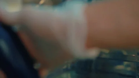 Cook puts meat wrapped in foil in the oven. Stock Footage 104936681