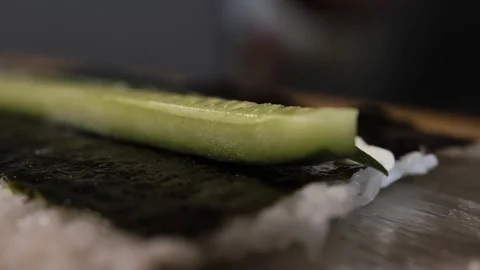 The cook puts the red fish on the rolls Stock Footage 124210305