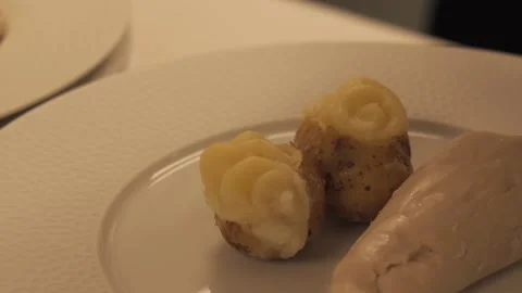 A cook puts sauce on potatoes Video stock 279640231