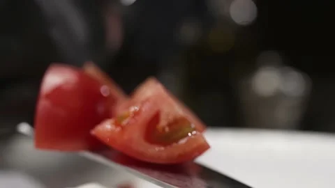 The cook puts the tomato on the plate Stock Footage 170396370