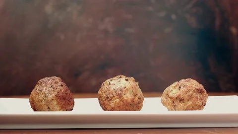 Cook puts tomato sauce on three meatballs 库存影片 137264120