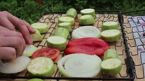 The cook puts the vegetables on the grill Stock Footage 134198729
