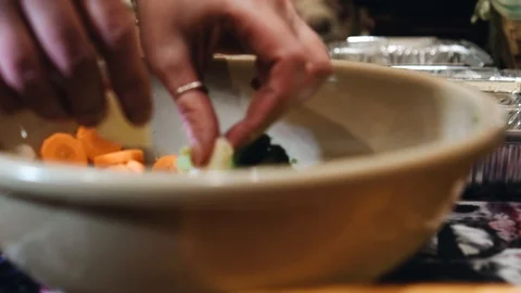 The cook puts vegetables on plates. The preparation of baked vegetables Stock Footage 123254997