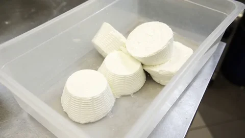 A cook putting some ricotta cheese in the basket, 4K Video stock 73069720