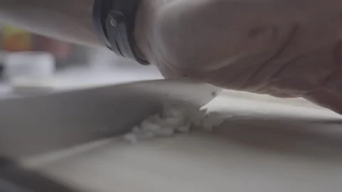 The cook quickly cuts an onion with a knife Stock Footage 266797872