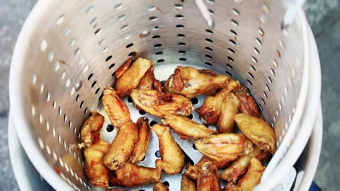 Cook Raises Crispy Chicken Wings In Fryer Basket Stock Footage 346649054