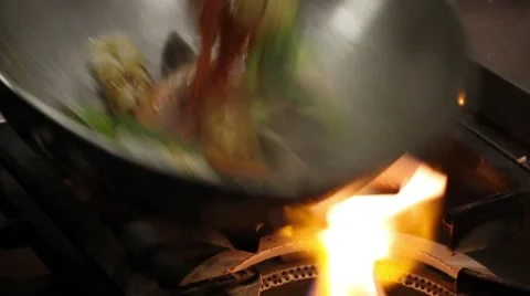 Cook roasts seafood and vegetables. From a series of Food Korean cuisine. Stock-Footage 50148124