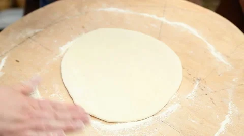 Cook rolls out the dough Stock-Footage 61574737